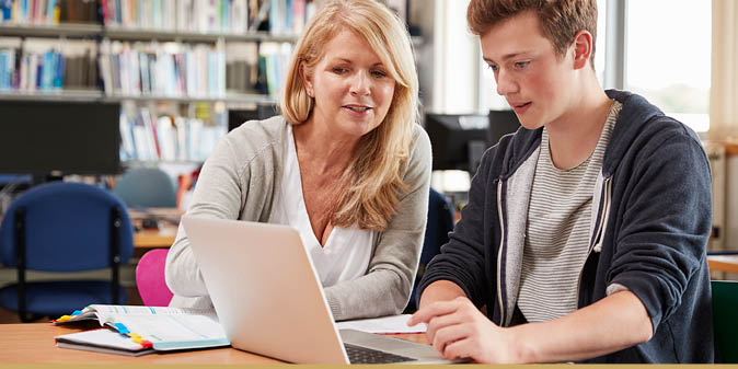 Mother and son preparing documents to leave for college