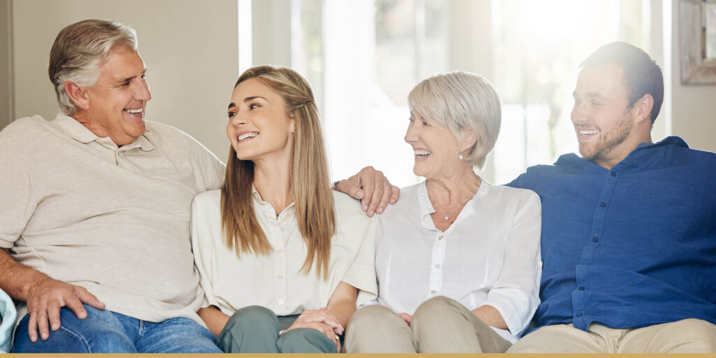 Multigenerational family sitting together on couch