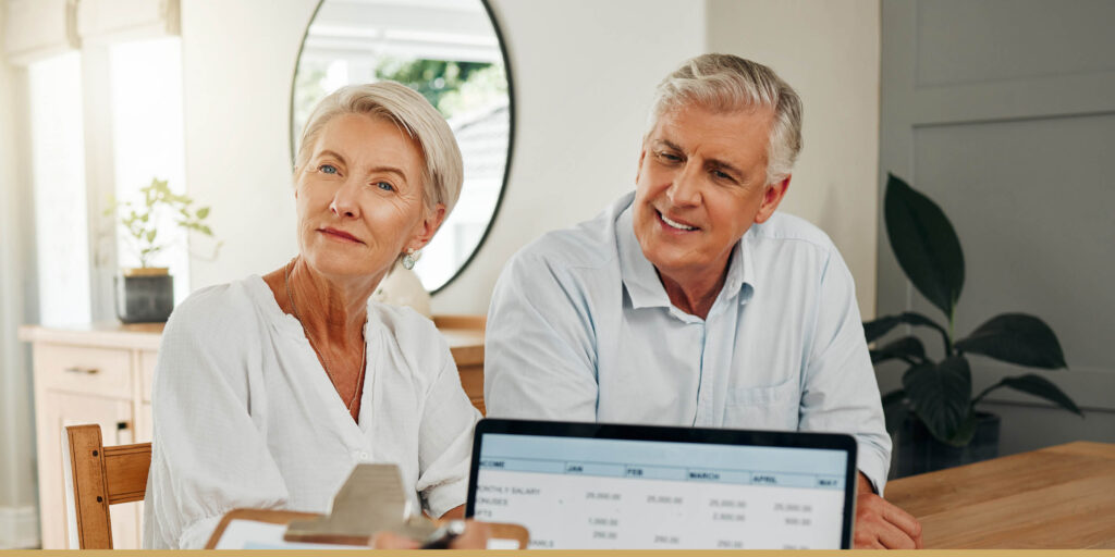 Older adult couple discussing finances