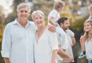 Older adults with family members playing outside