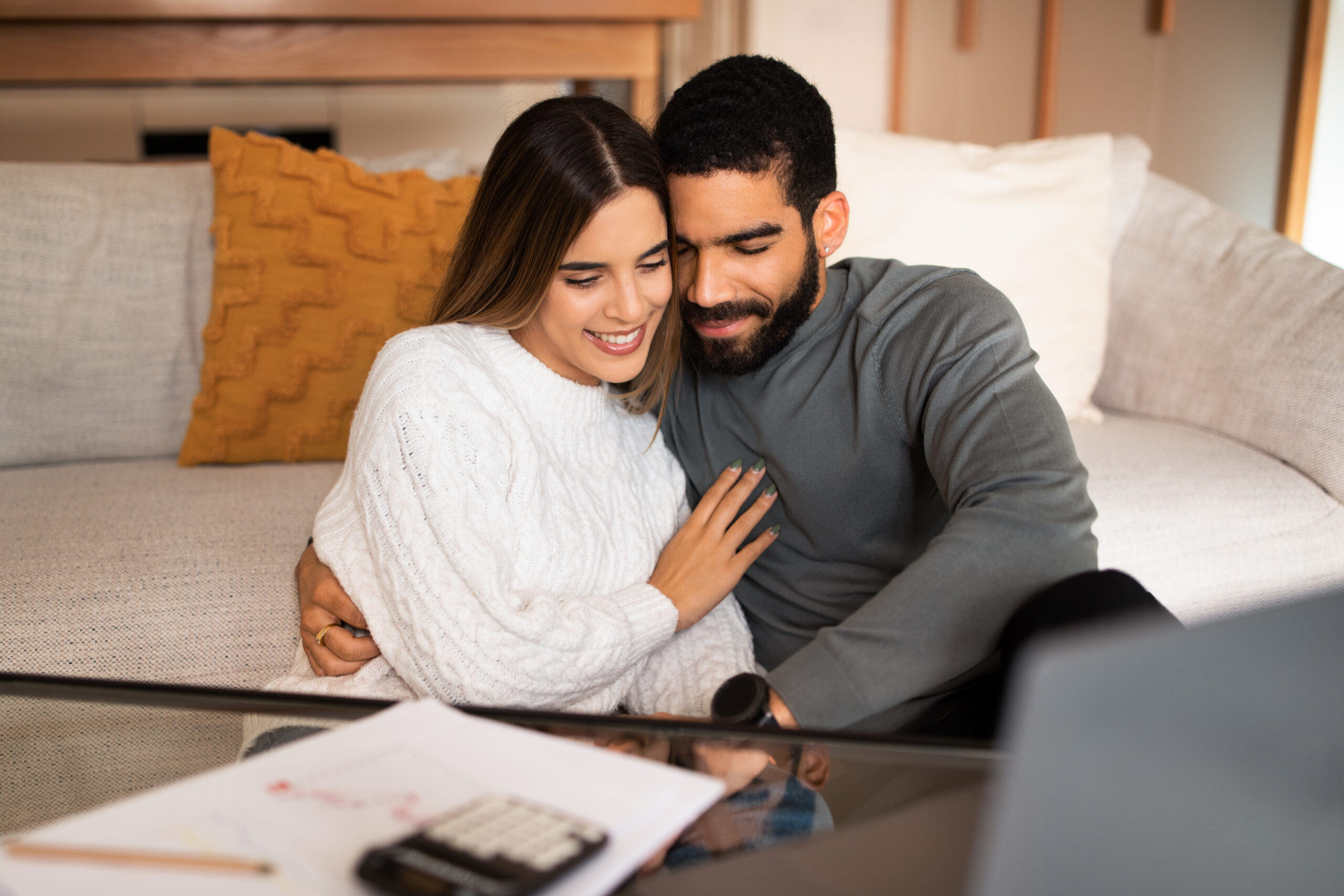 Newlywed couple at home discussing estate planning in New Hampshire