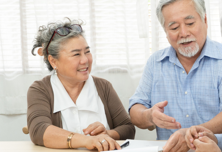 Senior couple meeting with a professional about estate planning documents